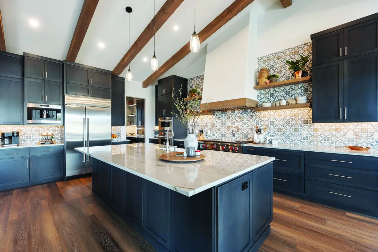 Modern craftsman kitchen with dark blue cabinetry and marble island — kitchen renovation by Barin Homes